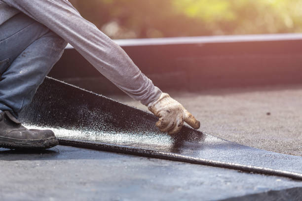 Professional Basement Waterproofing technician working in Whitehall, MI